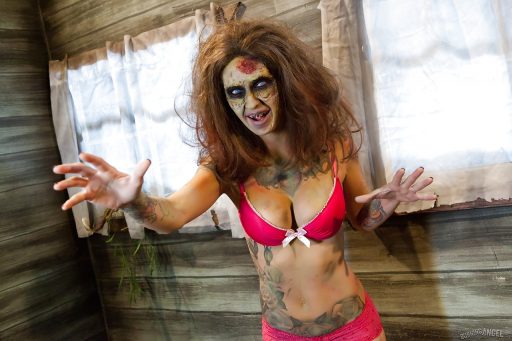 Saucy brunette cosplayer Kleio exposes her zombie tits and twat